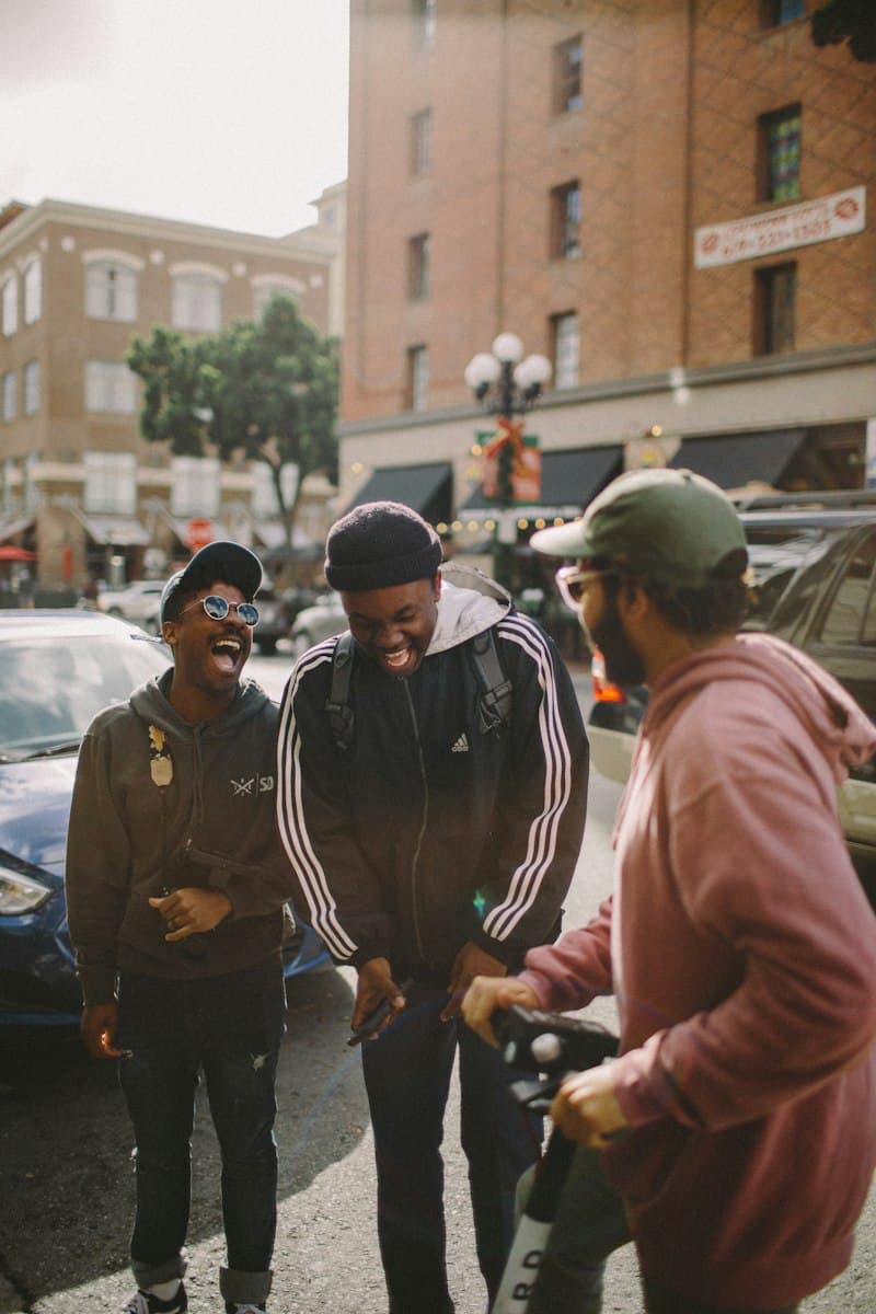 Friends laughing together on a city street